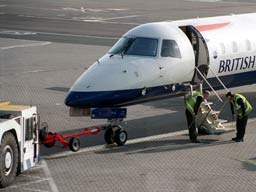 15 May 2003 (0736) BA Citiexpress G-EMBT on stand 18 at GLA receiving attention from Engineers